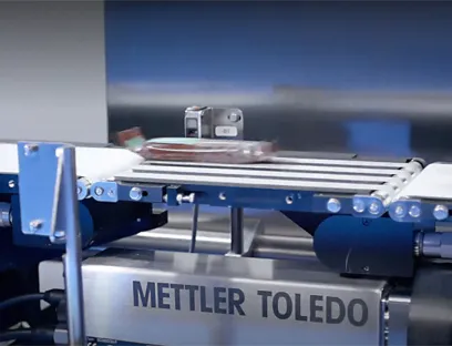 Checkweighing in use in the high-speed production of snacks and confectionery, Photo: Mettler-Toledo Metal detection, checkweighing and X-ray inspection in use in the high-speed production of snacks and confectionery