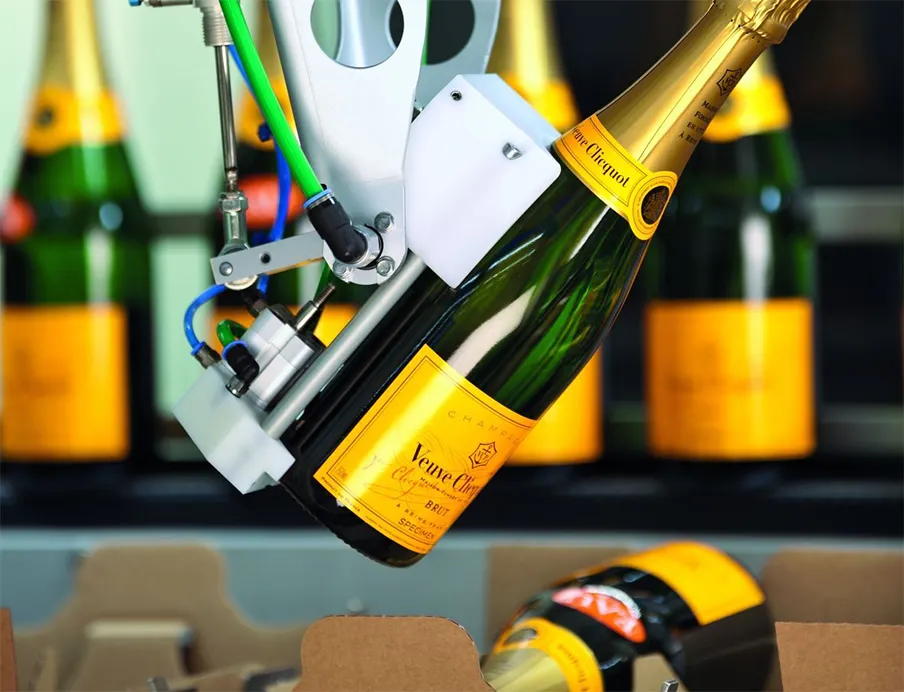 Robot-assisted packaging systems: Robots handle valuable champagne bottles without touching the labels
